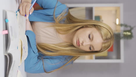 Vertical-video-of-Female-student-looking-at-camera-with-negative-and-negative-gesture.