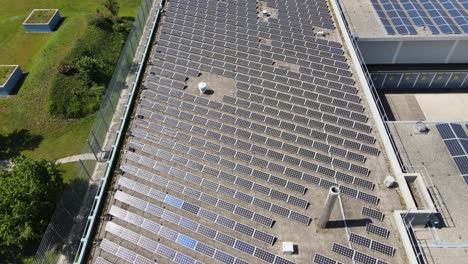 drone shot of solar pannels on roof of industrial building in zürich switzerland