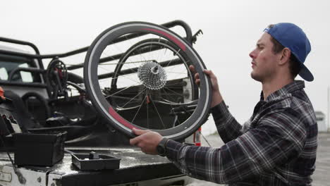 disabled man looking at the wheel of his chair