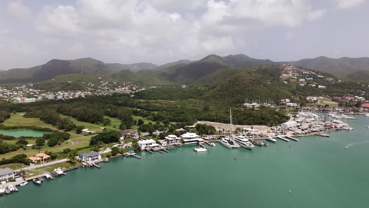 Aerial View of Luxury Waterfront Homes and Marina in Tropical Island Setting