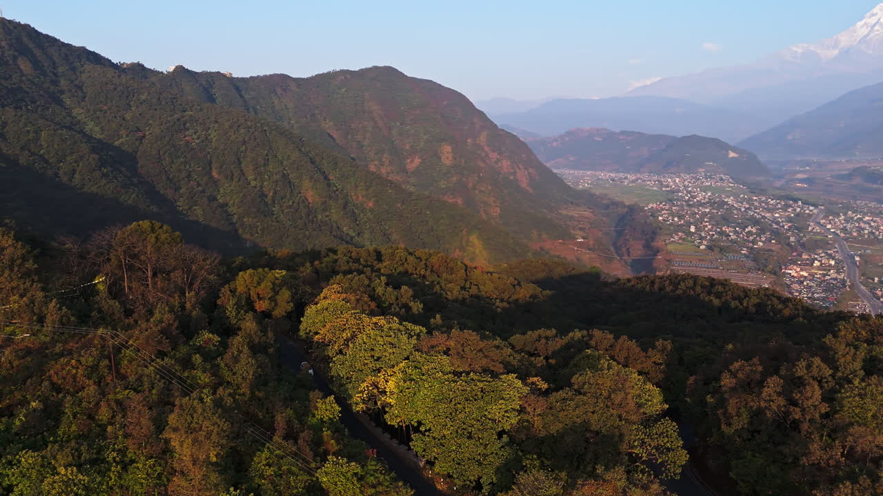 Aerial view of traffic on the Sarangkot mountain, sunny morning in Pokhara, Nepal