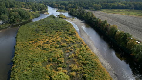 a stunning lowering drone shot revealing the beauty of the deerfield river winding through the mohawk trail.