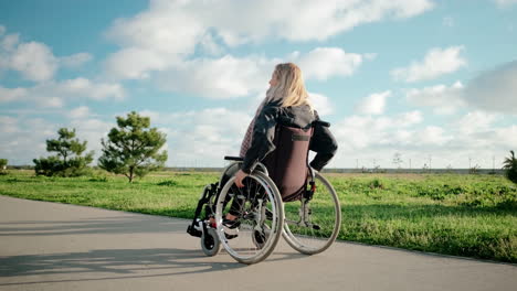 woman in wheelchair in a park