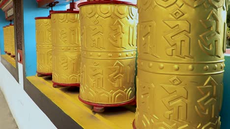 Buddhist-monastery-spinning-prayer-wheels-close-up-at-monastery-from-flat-angle-video-is-taken-at-bomdila-monastery-arunachal-pradesh-india