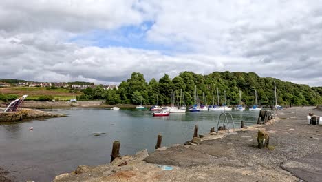 boats arriving and docking at aberdour harbor