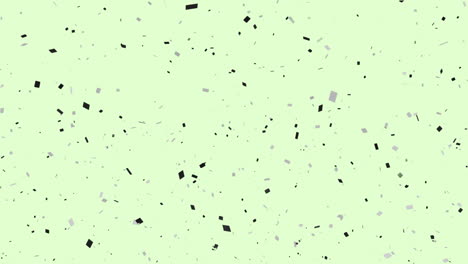 animación de confeti de varios colores que caen sobre un fondo verde