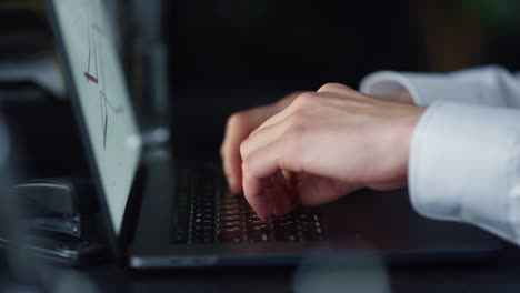 businessman hands typing on laptop at workplace. professional using computer