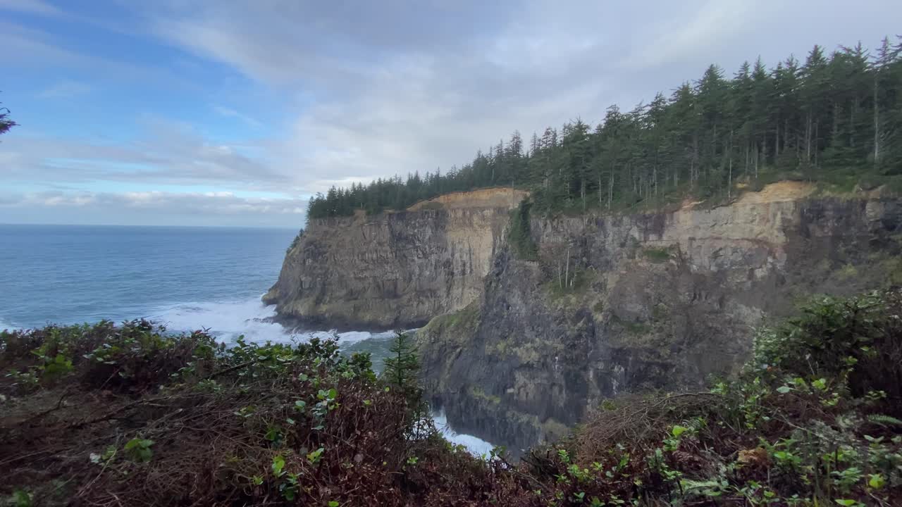 View of amazing huge cliffs by the oceanside in Oregon's coast