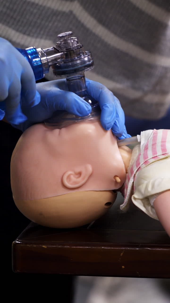 Cardiopulmonary resuscitation on baby. Education healthcare first aid of cardiopulmonary resuscitation on baby. Vertical video