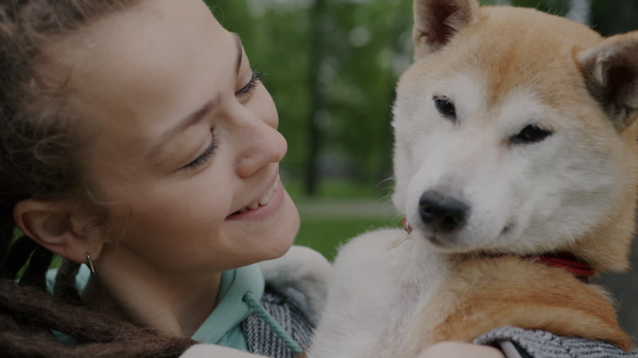 Woman with her Shiba Inu Dog