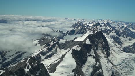 Snow-capped-rocky-mountains-in-Aoraki-Mountain-Cook-National-Park,-Southern-Alps,-New-Zealand-from-helicopter-scenic-flight