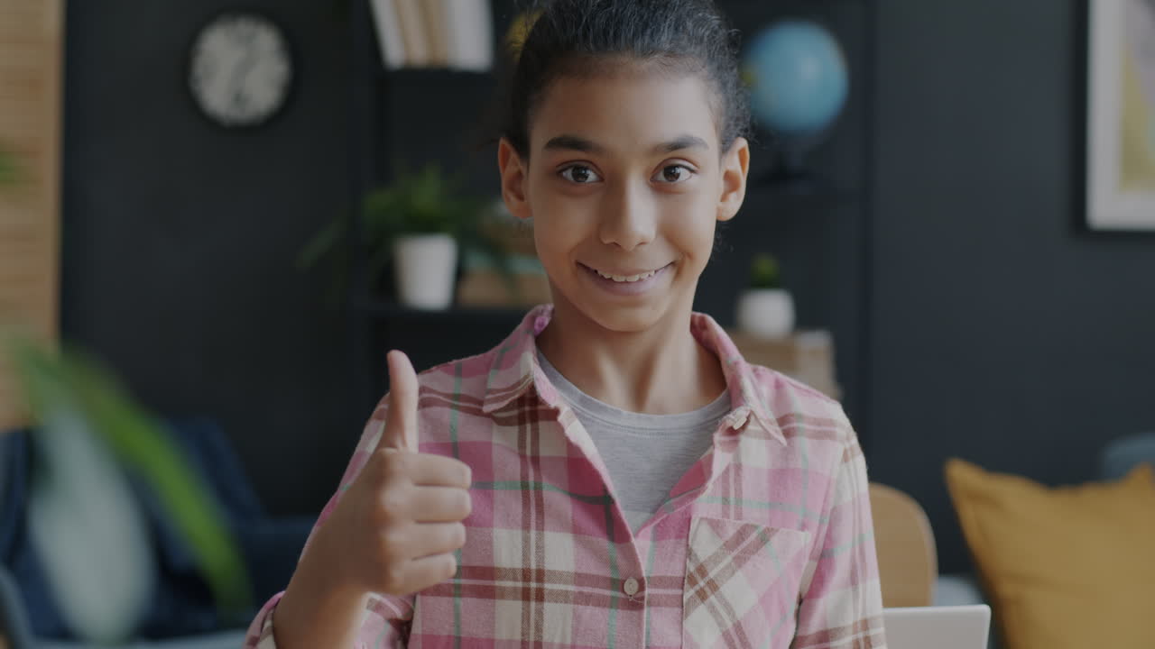 Girl with Tablet and Thumbs Up