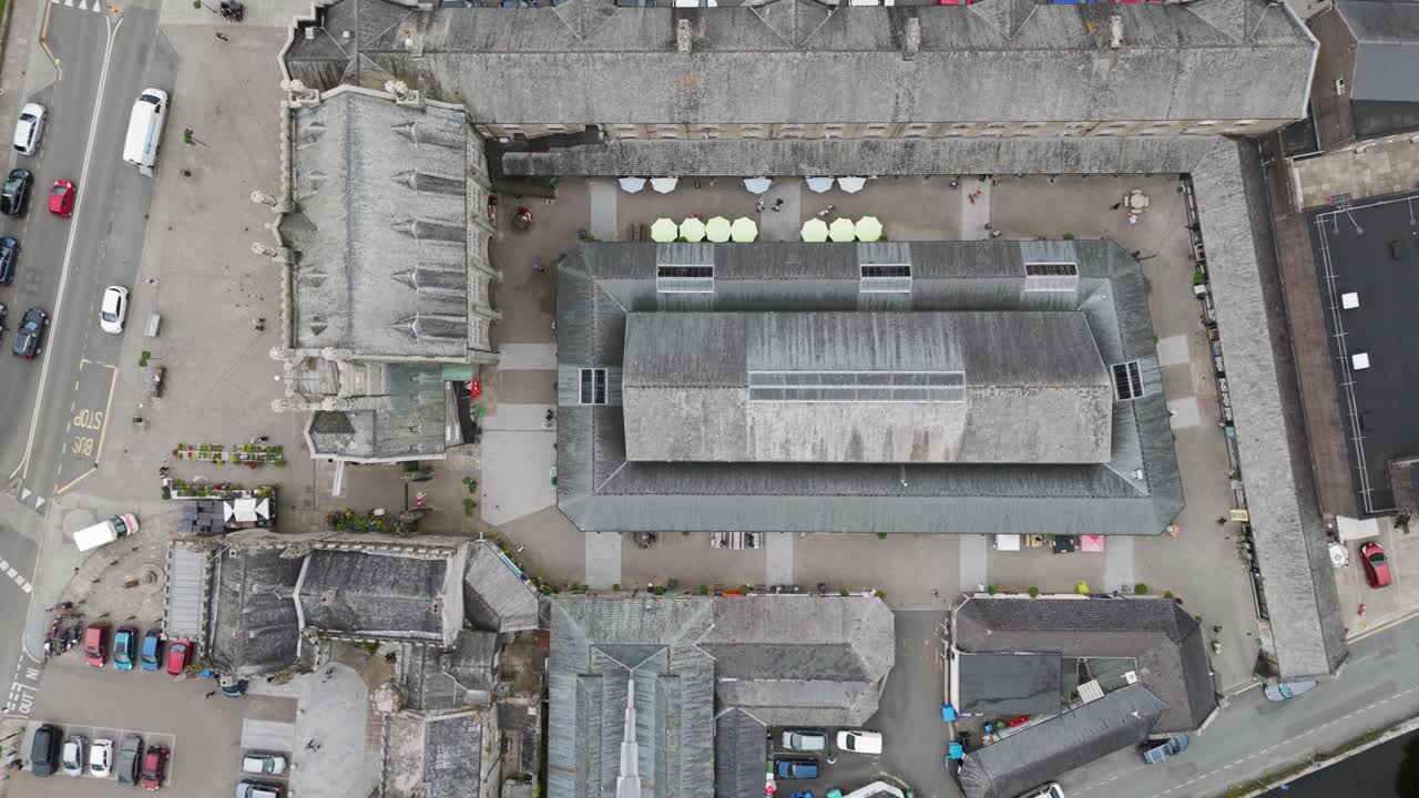 Aerial View of a Historic Town Center with Market Hall and Surrounding Buildings