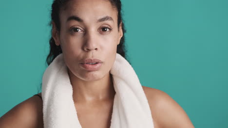 african american tired woman over blue background.