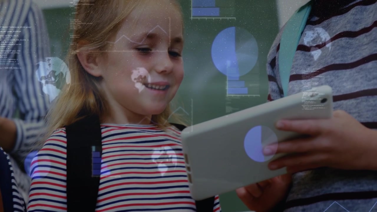 Pupil holding tablet smiling as second tablet entering frame charts globe overlaying for education