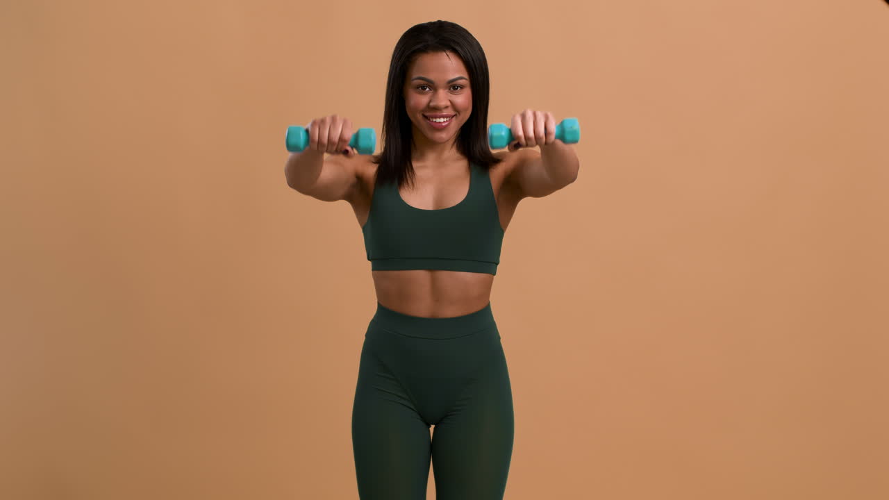 Woman Exercising with Dumbbells