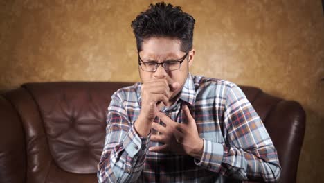 man coughing