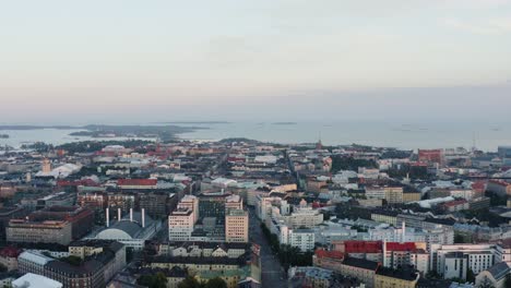 aerial tilt over helsinki buildings into sky with copyspace cityscape