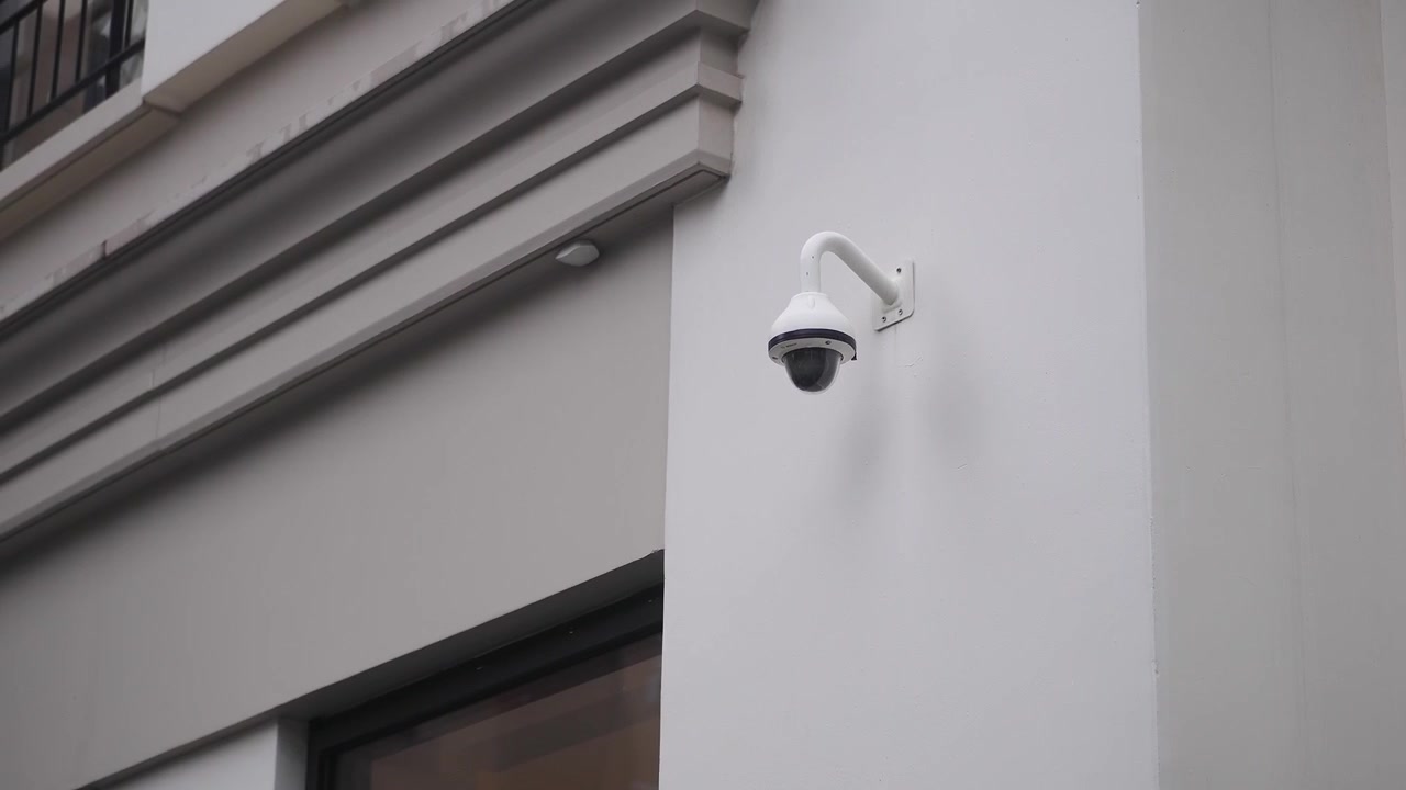 Security Camera Mounted on a Modern Building Exterior Wall