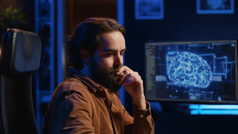 programmer using computer to update ai neural networks, drinking coffee