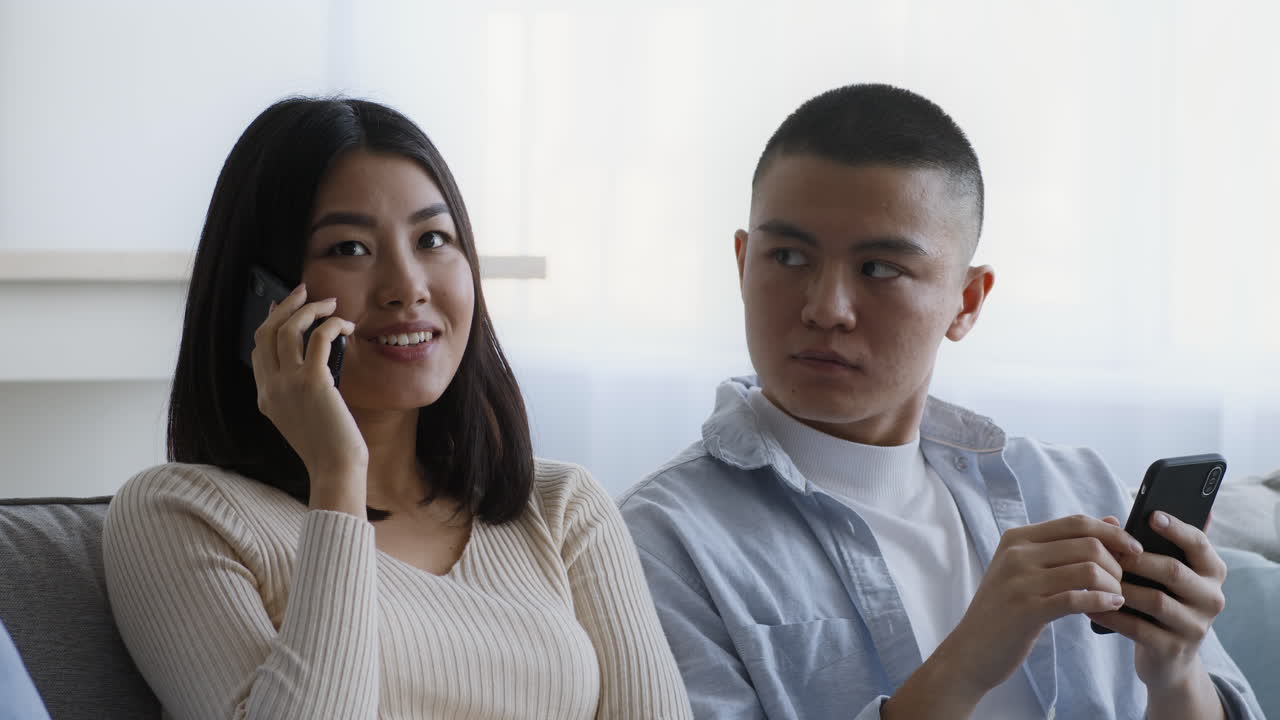 Couple using smartphones and phone call