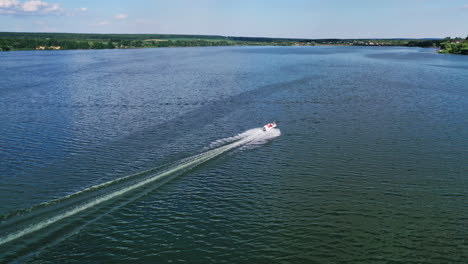 boat floating on the river. aerial drone view of small motor boat floating on river