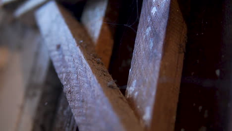 Close-up-of-old-wooden-gate-at-a-scary-basement-with-cobwebs