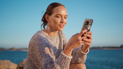 carefree girl taking picture in summer sunlight closeup. smiling lady enjoy lake