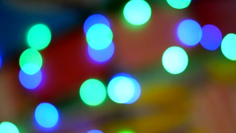 blurred colorful lights. red, green, yellow, orange, blue defocused glittering bokeh festive background.