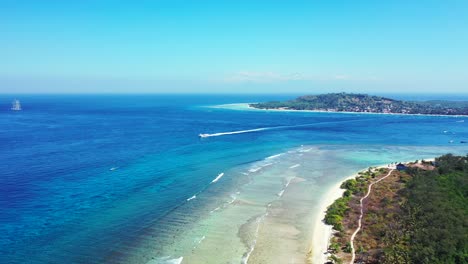 Boat-sailing-between-two-tropical-islands-with-preserved-nature-and-unspoiled-white-sandy-beaches