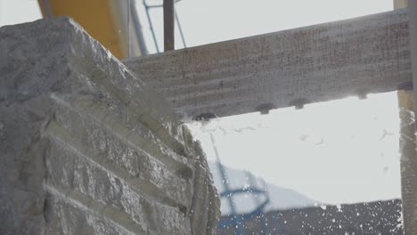 Close-Up-Shot-Of-Saw-Machine-Cutting-Marble-Block-Stone