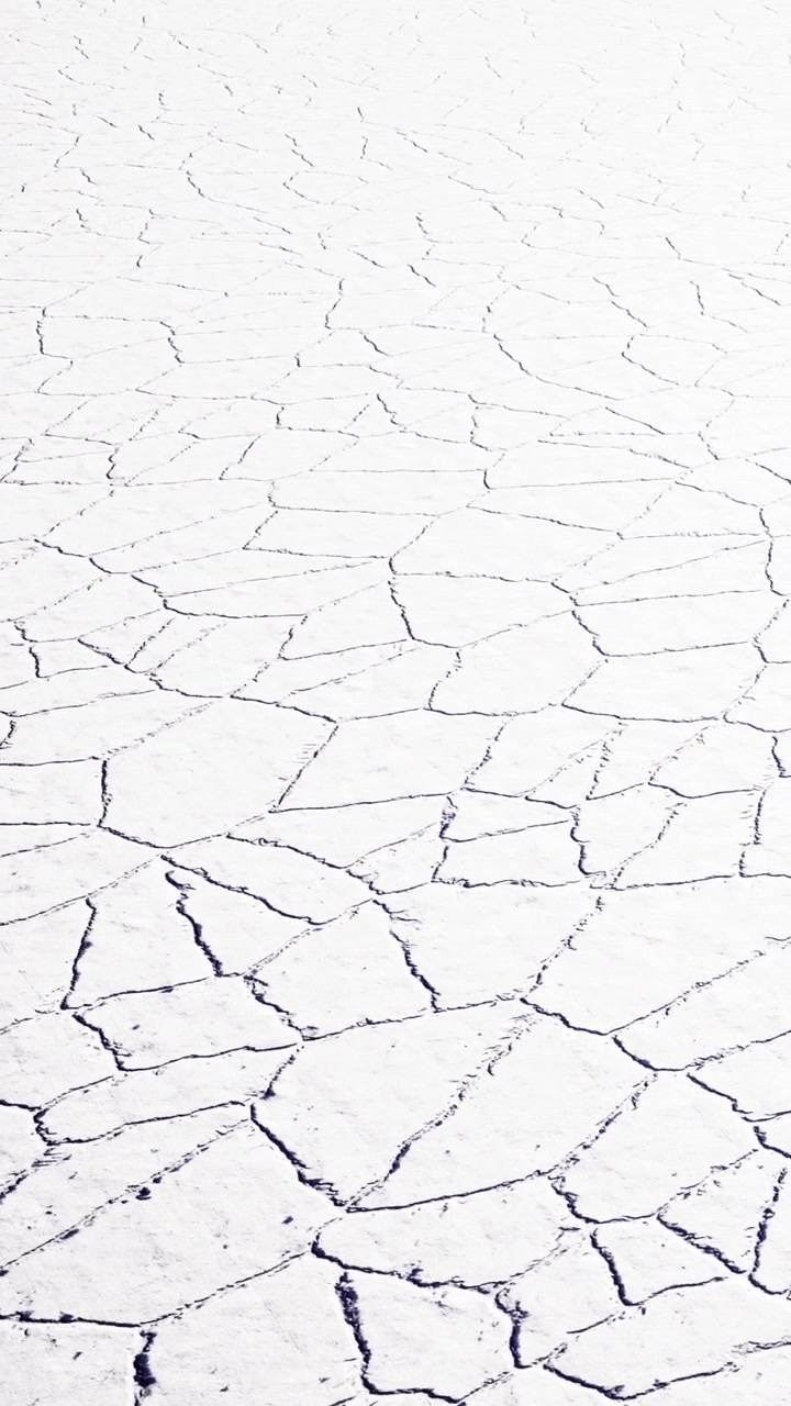 Cracked dry ground at a remote location during a sunny day in the summer