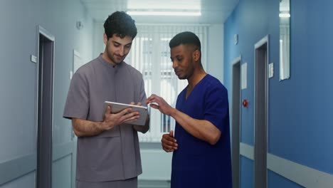 doctors discussing in hospital corridor