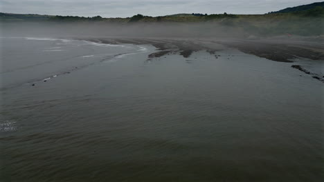 Low-Aerial-Drone-Shot-of-Mist-on-North-Yorkshire-Coast-Near-Robin-Hood's-Bay