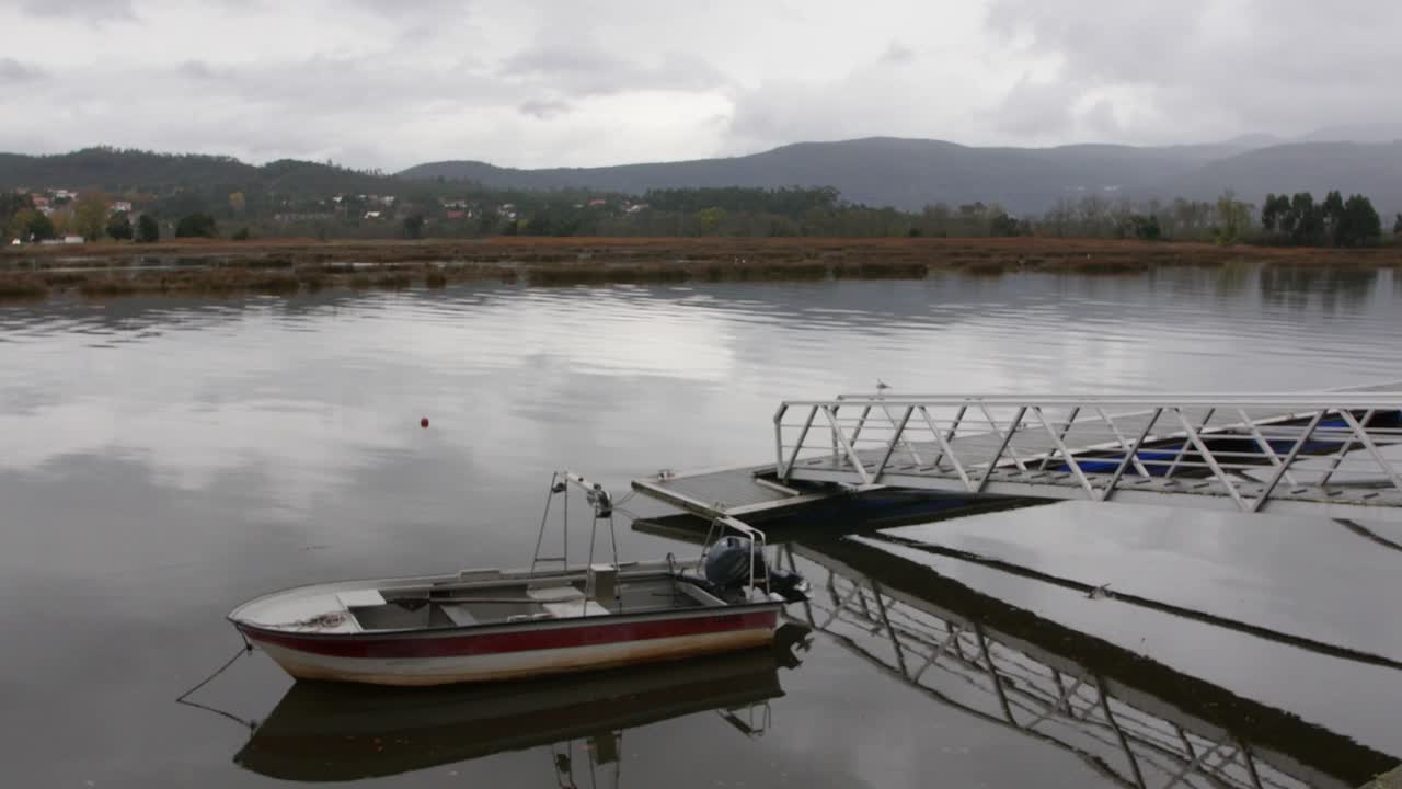 Boat on the river in a winter time, the other side of the river is Spain. Portugal, Caminha.