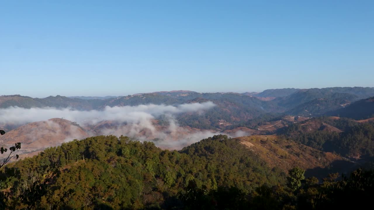mountain range cloud movements at morning with bright blue sky