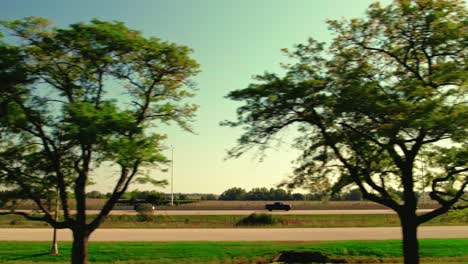 Side-tracking-a-red-semi-truck-driving-on-interstate-very-fast