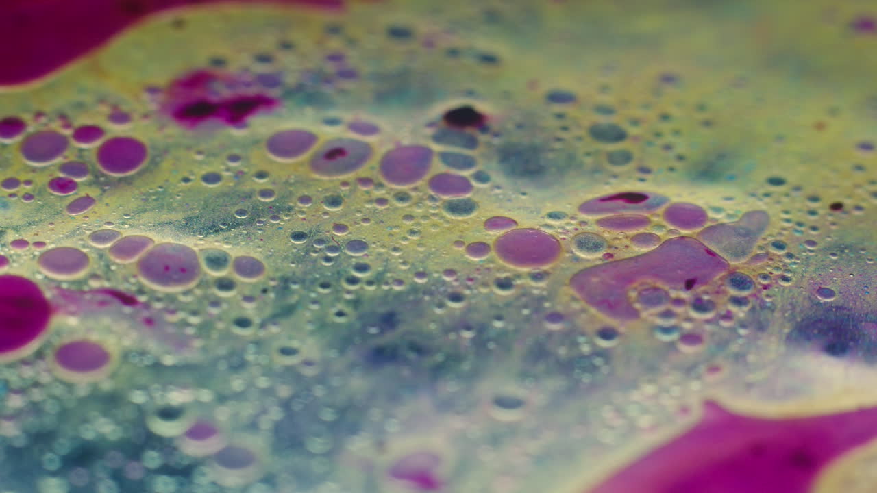 Colourful, organic, liquids macro shots buzzing and flowing