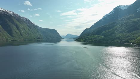 Lustrafjorden-Norway---And-arm-of-Sognefjord-seen-from-Skjolden-during-sunny-spring-day---Forward-moving-rising-aerial