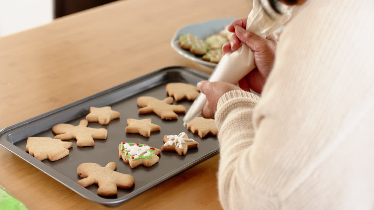 Baking Christmas cookies at home, senior enjoying festive holiday preparations