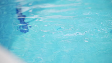 the ripples of water on the surface of a pool