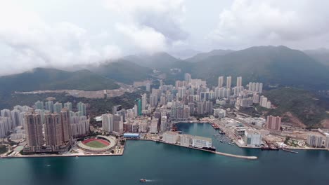 Hong-Kong-bay-and-waterfront-residential-skyscrapers,-Aerial-view