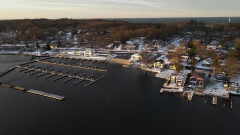 Slow-aerial-pan-over-the-waters-of-Muskegon-lake-during-a-Fall-Sunrise