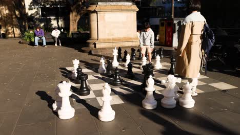 people playing giant chess outdoors in melbourne