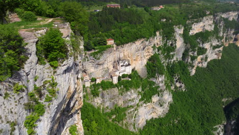 aerial view monte baldo rocky cliff with santuario madonna della corona in spiazzi, verona, italy.