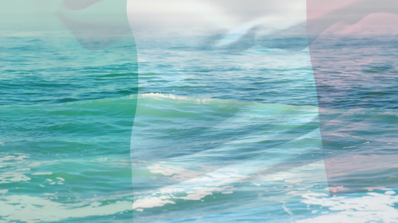 composición digital de ondear la bandera de italia contra las olas en el mar