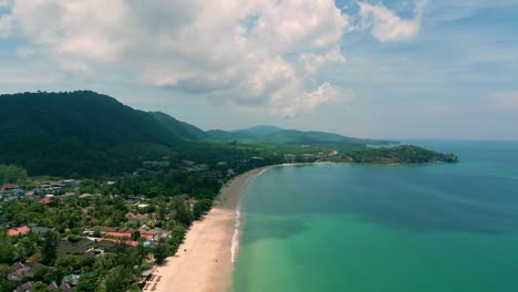 4K-Cinematic-nature-drone-footage-of-a-panoramic-aerial-view-of-the-beautiful-beaches-and-mountains-on-the-island-of-Koh-Lanta-in-Krabi,-South-Thailand,on-a-sunny-day