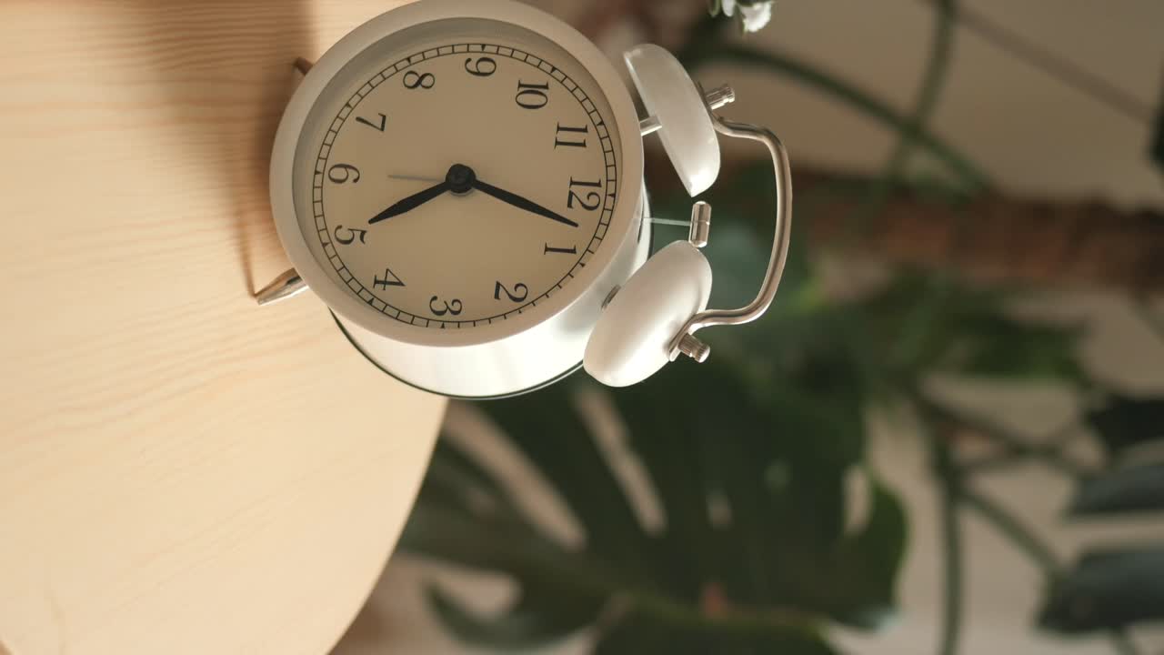 Alarm clock on a wooden table