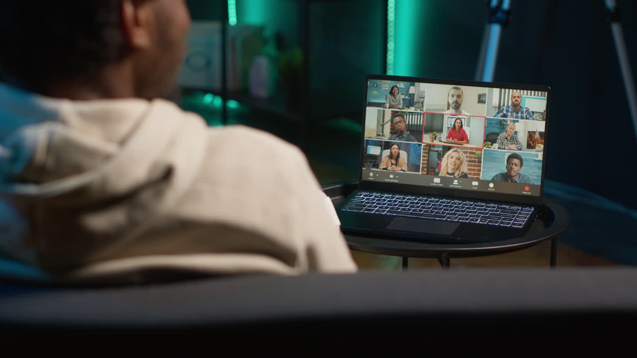Smiling black man hosting a virtual family meeting online via video conference, meeting with the relatives and sharing latest news. Person uses web connection to chat with loved ones. Camera A.