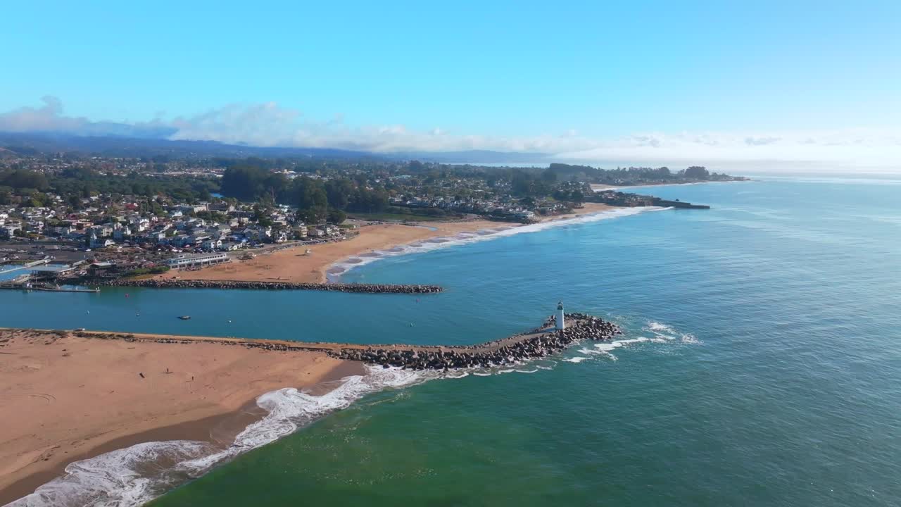 Pleasure Point SeaBright Blacks Beach Walton Lighthouse Monterey Bay Santa Cruz California aerial drone scenic landscape deep blue surf waves sand Pacific Ocean morning blue sky mist fog circle left